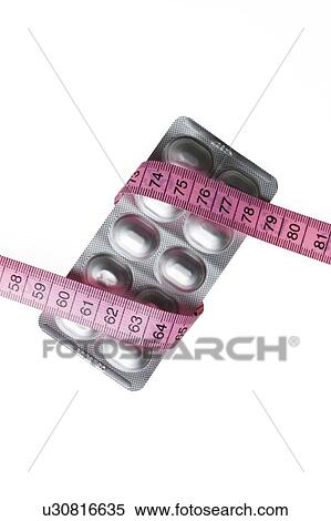 Slimming pills, conceptual image View Large Photo Image Stock Photography - Slimming pills, conceptual image. Fotosearch