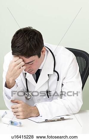 Stressed doctor View Large Photo Image Stock Photo - Stressed doctor. Fotosearch