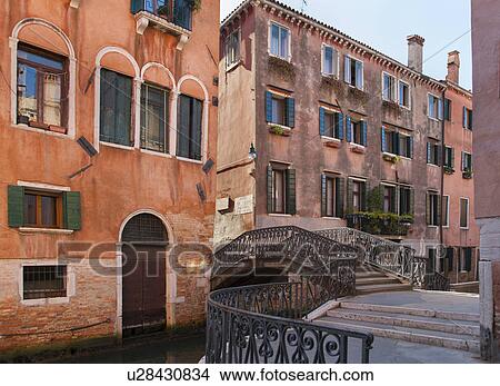 Picture - Apartment buildings and bridge on canal. Fotosearch
