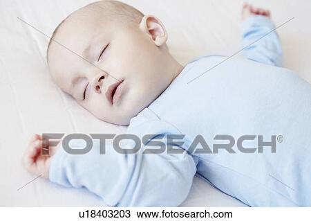 Baby boy sleeping in crib View Large Photo Image Stock Image - Baby boy sleeping in crib. Fotosearch