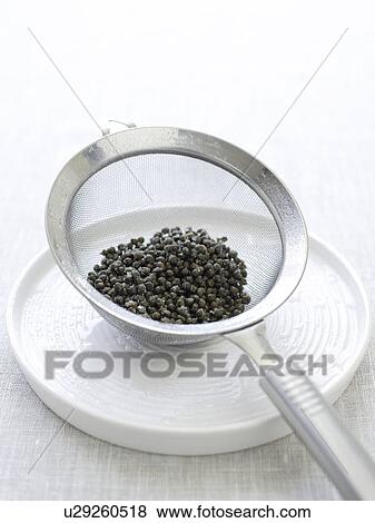Baby capers in sieve on plate View Large Photo Image Stock Photo - Baby capers in sieve on plate. Fotosearch