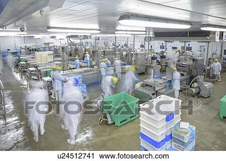 Blurred view of workers in factory View Large Photo Image Stock Image - Blurred view of workers in factory. Fotosearch