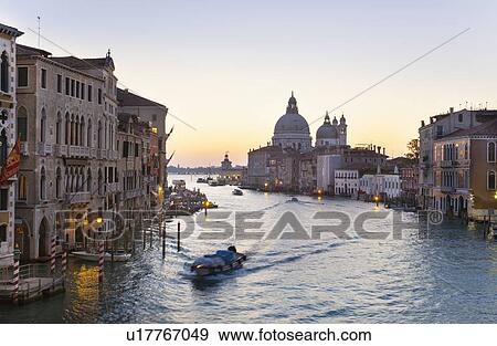 Boat sailing in urban canal View Large Photo Image Stock Photo - Boat sailing in urban canal. Fotosearch