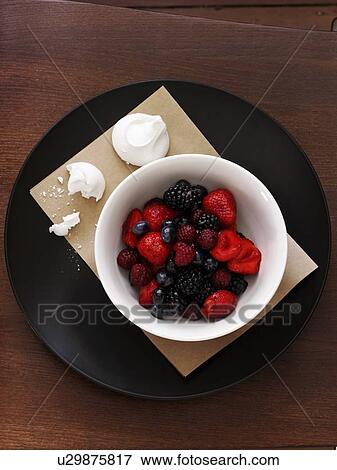 Bowl of berries with meringue View Large Photo Image Stock Photo - Bowl of berries with meringue. Fotosearch
