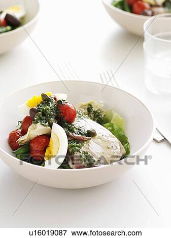 Bowl of eggs with vegetables and sauce View Large Photo Image Stock Photo - Bowl of eggs with vegetables and sauce. Fotosearch