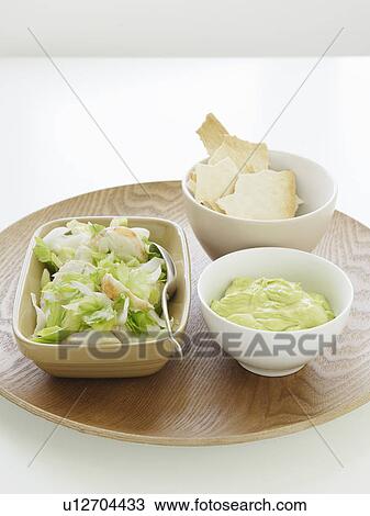 Stock Image - Bowls of lobster, celery heart and cream. Fotosearch
