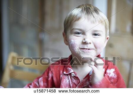 Boys face covered in flour in kitchen View Large Photo Image Stock Photo - Boys face covered in flour in kitchen. Fotosearch