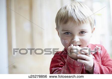 Boys face covered in flour in kitchen View Large Photo Image Stock Photograph - Boys face covered in flour in kitchen. Fotosearch