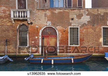 Stock Photography - Buildings and boats on urban canal. Fotosearch