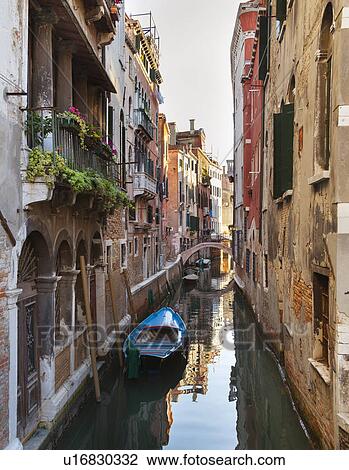 Buildings and rowboats on urban canal View Large Photo Image Stock Image - Buildings and rowboats on urban canal. Fotosearch