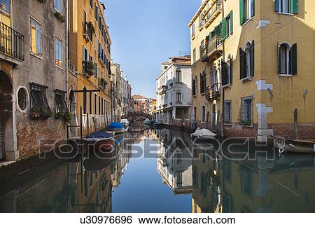 Buildings on urban canal View Large Photo Image Stock Photograph - Buildings on urban canal. Fotosearch