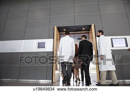 Picture - Business people and doctors in office. Fotosearch