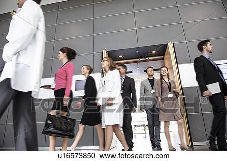 Stock Image - Business people and doctors in office. Fotosearch