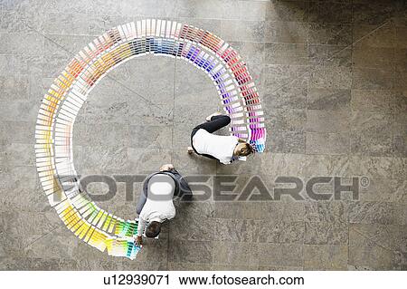 Business people examining paint swatches View Large Photo Image Stock Image - Business people examining paint swatches. Fotosearch