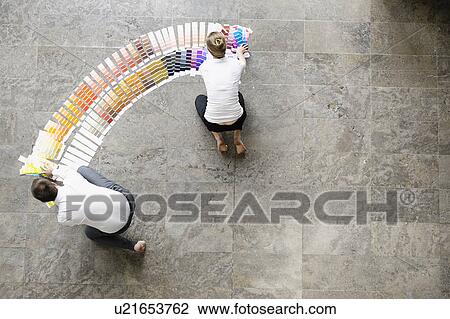 Business people examining paint swatches View Large Photo Image Stock Image - Business people examining paint swatches. Fotosearch
