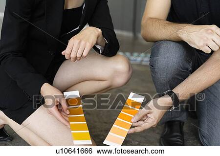 Business people examining paint swatches View Large Photo Image Stock Photograph - Business people examining paint swatches. Fotosearch