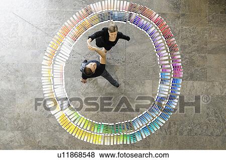 Stock Photo - Business people in paint swatches. Fotosearch