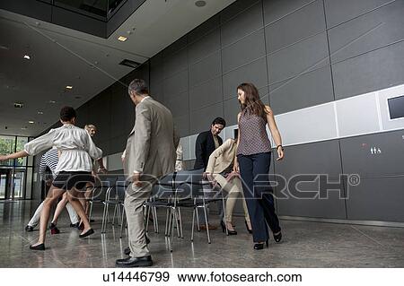 Business people playing musical chairs View Large Photo Image Stock Photo - Business people playing musical chairs. Fotosearch
