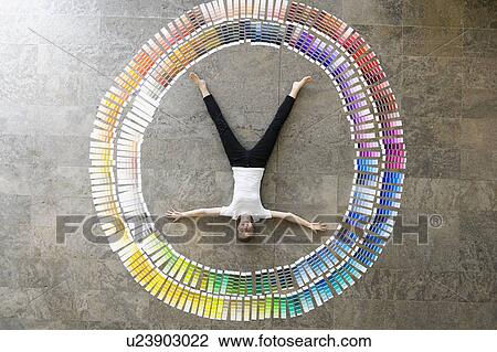 Businessman laying in paint swatches View Large Photo Image Stock Image - Businessman laying in paint swatches. Fotosearch