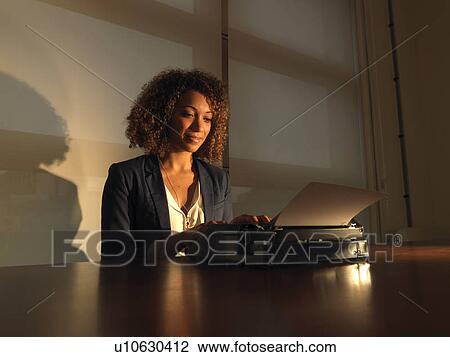 Businesswoman using typewriter View Large Photo Image Stock Image - Businesswoman using typewriter. Fotosearch