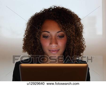 Businesswoman working on laptop View Large Photo Image Stock Image - Businesswoman working on laptop. Fotosearch