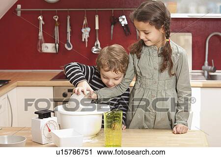 Children cooking together in kitchen View Large Photo Image Stock Image - Children cooking together in kitchen. Fotosearch