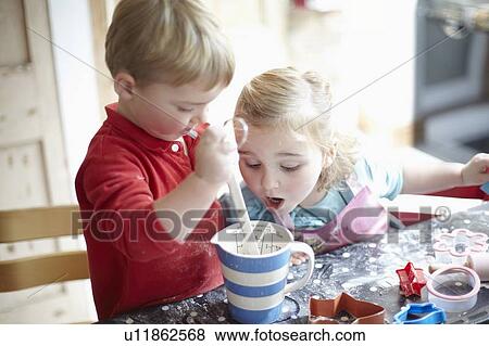 Children cooking together in kitchen View Large Photo Image Stock Photo - Children cooking together in kitchen. Fotosearch