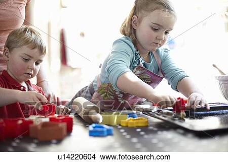 Children playing with shapes on table View Large Photo Image Picture - Children playing with shapes on table. Fotosearch