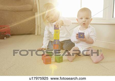 Children playing with toys on floor View Large Photo Image Stock Photography - Children playing with toys on floor. Fotosearch