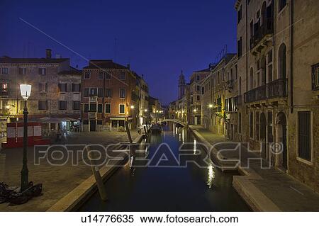 Stock Photography - City lights reflected in urban canal. Fotosearch