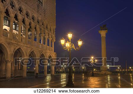 Picture - City lights reflected on wet street. Fotosearch
