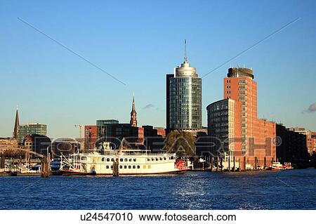 Stock Image - City skyline on waterfront. Fotosearch