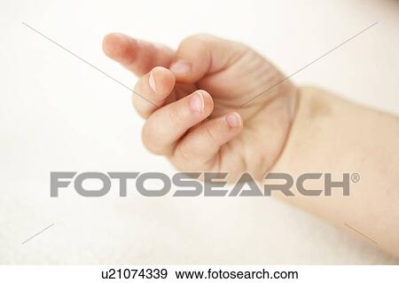 Stock Photo - Close up of baby girls fingers. Fotosearch