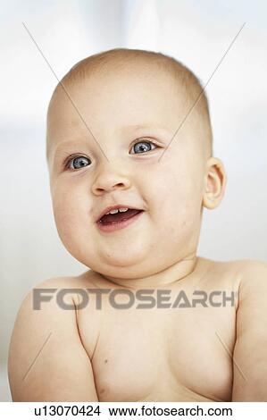 Picture - Close up of baby girls smiling face. Fotosearch