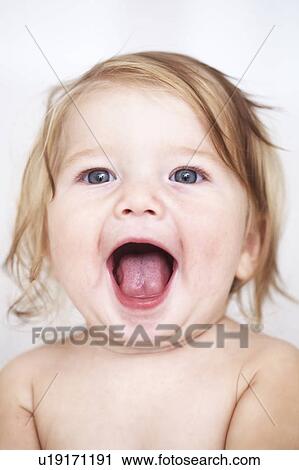 Close up of baby girls smiling face View Large Photo Image Stock Image - Close up of baby girls smiling face. Fotosearch