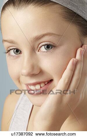 Close up of girls smiling face View Large Photo Image Stock Image - Close up of girls smiling face. Fotosearch