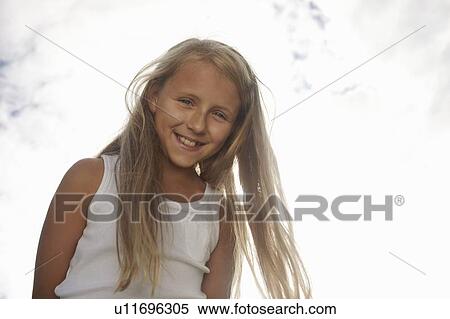 Stock Photography - Close up of girls smiling face. Fotosearch