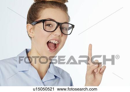 Stock Image - Close up of smiling girl in braces. Fotosearch