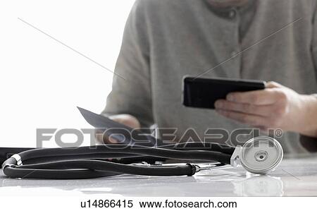 Stock Photography - Close up of stethoscope on desk. Fotosearch