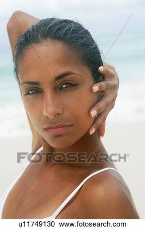 Stock Image - Close up of womans serious face. Fotosearch