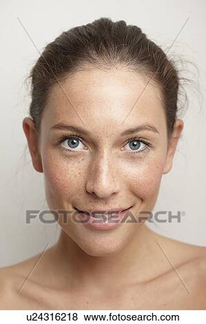 Close up of womans smiling face View Large Photo Image Stock Photo - Close up of womans smiling face. Fotosearch