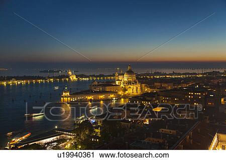 Coastal city lit up at night View Large Photo Image Stock Image - Coastal city lit up at night. Fotosearch