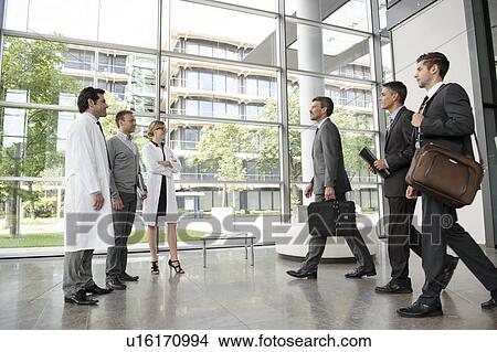 Picture - Doctors and businessmen meeting. Fotosearch