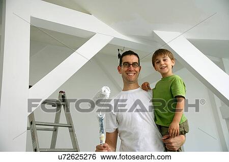 Father and son painting new house View Large Photo Image Stock Photograph - Father and son painting new house. Fotosearch