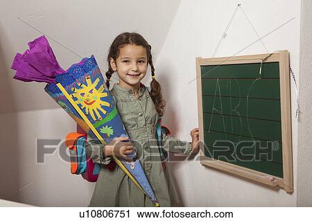 Girl holding colorful painted cone View Large Photo Image Stock Image - Girl holding colorful painted cone. Fotosearch