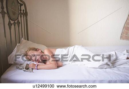 Girl sleeping in bed View Large Photo Image Stock Image - Girl sleeping in bed. Fotosearch