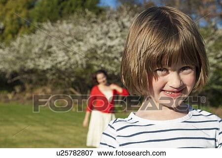 Girl smiling in park View Large Photo Image Stock Photo - Girl smiling in park. Fotosearch
