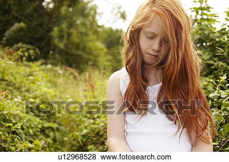 Girl walking in meadow View Large Photo Image Stock Photo - Girl walking in meadow. Fotosearch