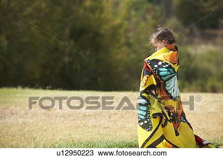 Girl wrapped in colorful towel outdoors View Large Photo Image Stock Image - Girl wrapped in colorful towel outdoors. Fotosearch
