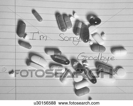 Handful of pills on suicide note View Large Photo Image Stock Photo - Handful of pills on suicide note. Fotosearch